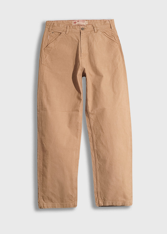 Tan work pants with a relaxed fit, featuring front pockets and belt loops, displayed on a white background.