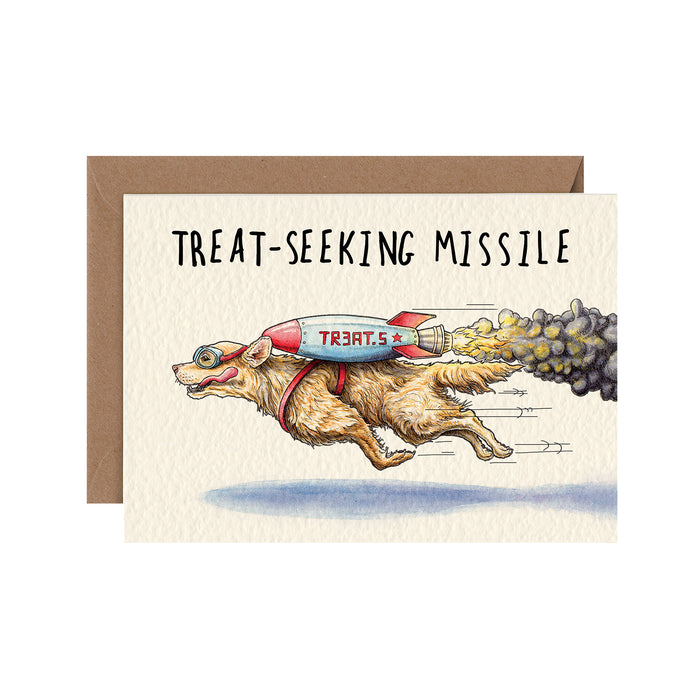A funny illustration of a golden retriever flying by wearing a rocket strapped to its back and goggles, under the caption "Treat-Seeking Missile".
