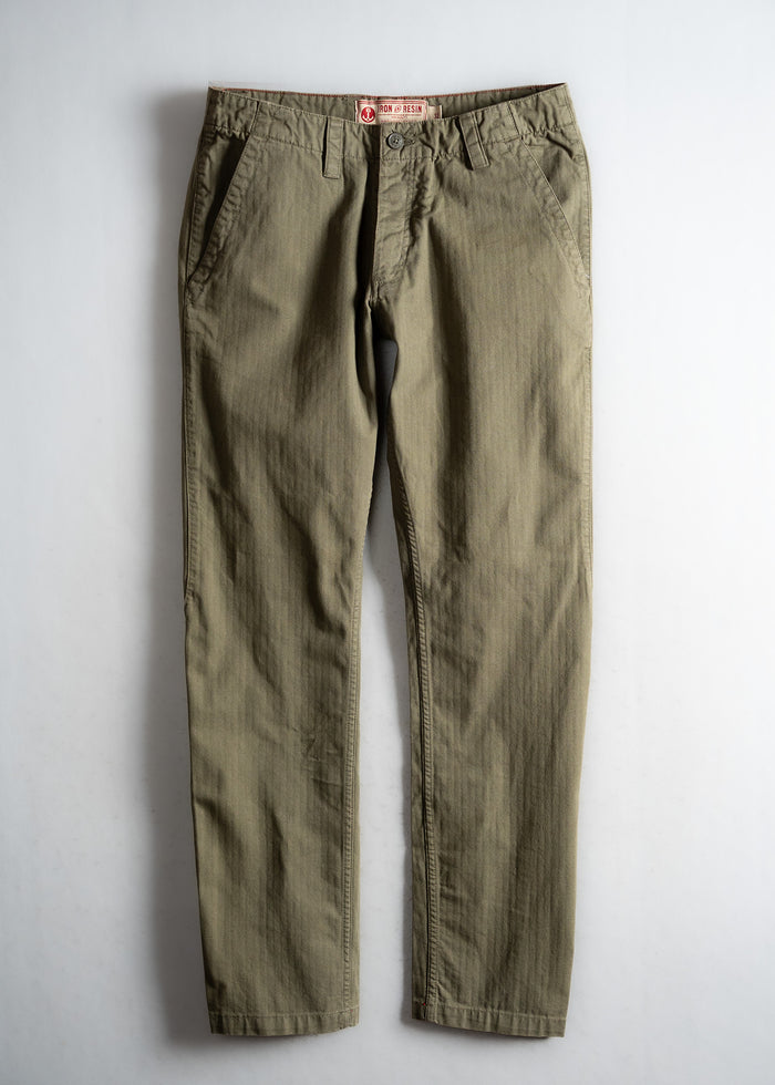 Olive green pants with a button closure and side pockets, displayed flat on a light background, showcasing casual style.