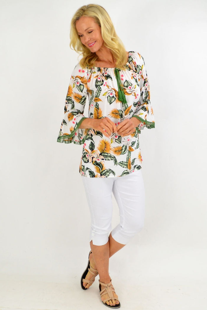 White tropical tassel off-shoulder tunic top with boho floral print, made from lightweight rayon fabric by Missy Q.