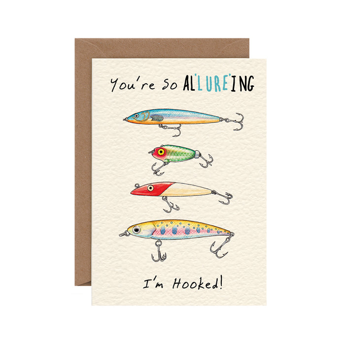 An ink and watercolor illustration of four colorful fishing lures with the caption "You're so AL'LURE'ING, I'm Hooked!"