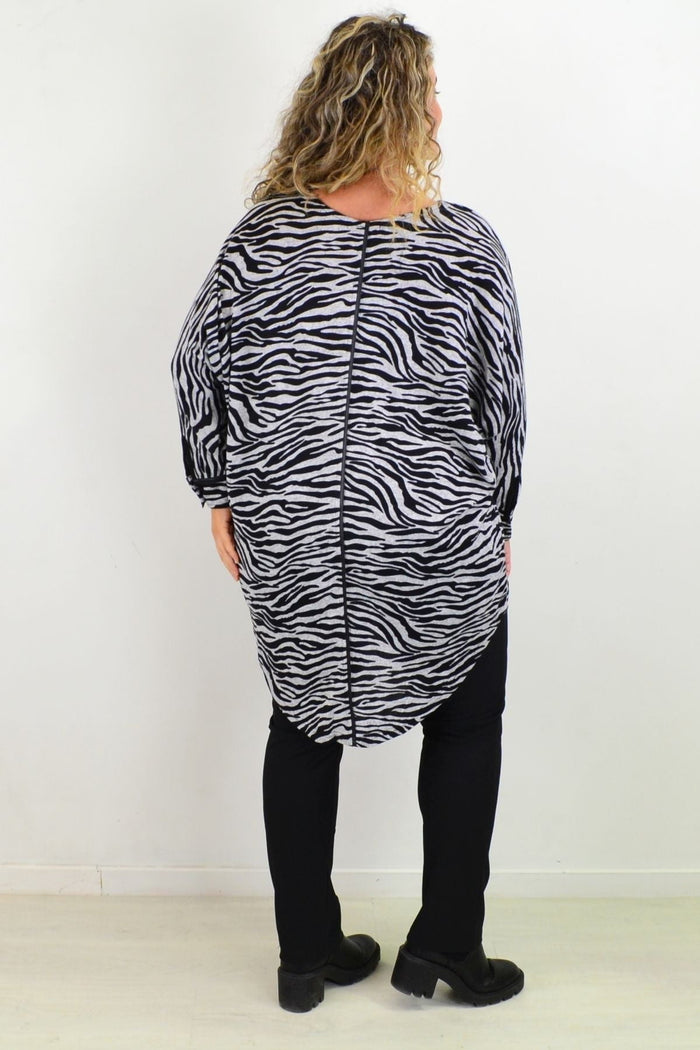 Caroline Morgan Zelma Zebra relaxed hi-low hem tunic top with bold zebra print and flowing silhouette, styled with long sleeves.
