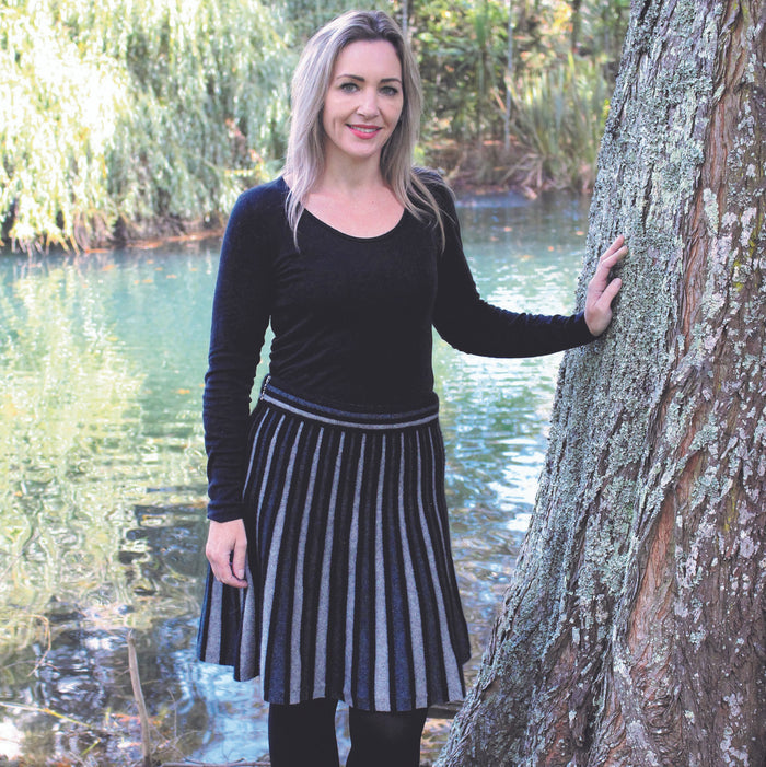 Woman wearing Charcoal colour wedge skirt.